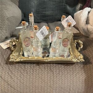 Vintage mirrored tray with mini glass bottles